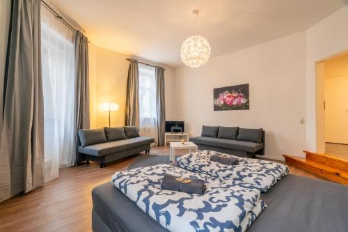 a bedroom with a bed and a living room at Das echte Leipzig entdecken -Aura3000 in Leipzig