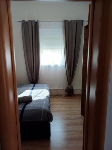 Postel nebo postele na pokoji v ubytování Apartments Sarah