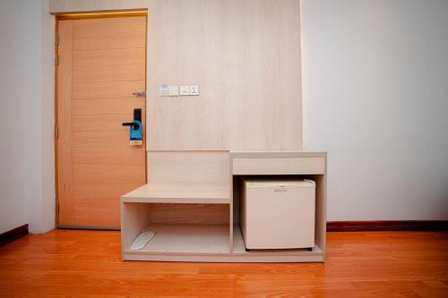 a room with a counter with a door and a table at Royal Raj Hotel in Rājshāhi