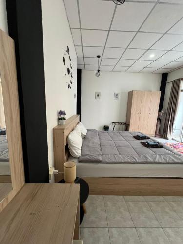 a bedroom with a large bed in a room at Lo Sfizio in Patong Beach