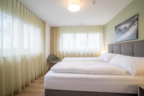 Postel nebo postele na pokoji v ubytování Modern City Apartments