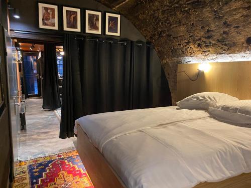 Postel nebo postele na pokoji v ubytování Beim Mulles - Black Smith - Vianden