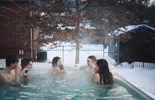 a group of people in a swimming pool at PARADISE VILLa Bowmanville in Bowmanville