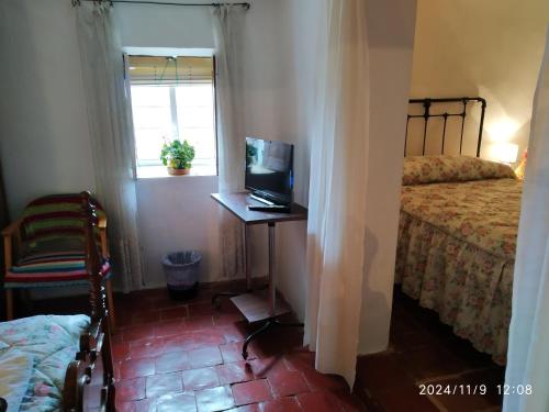 Ένα ή περισσότερα κρεβάτια σε δωμάτιο στο La Casita de San Nicolás