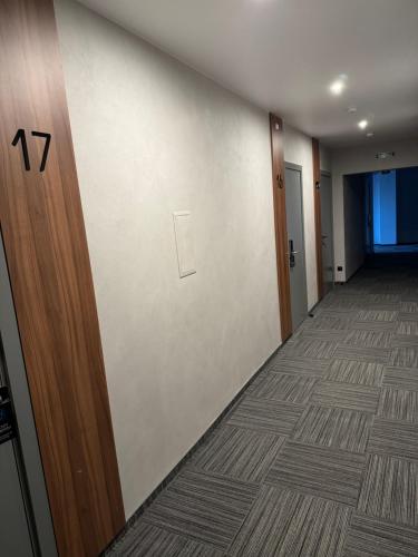 a hallway with a door with the number on it at Alir in Zhytomyr