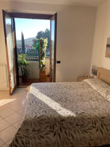 Una cama o camas en una habitación de Chianti Roses Monteriggioni