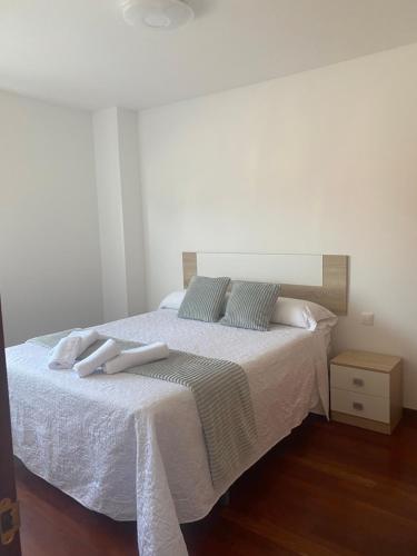 Ένα ή περισσότερα κρεβάτια σε δωμάτιο στο Apartamento Cuchia