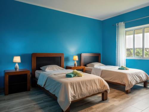 Ένα ή περισσότερα κρεβάτια σε δωμάτιο στο Casa dos cinco sentidos