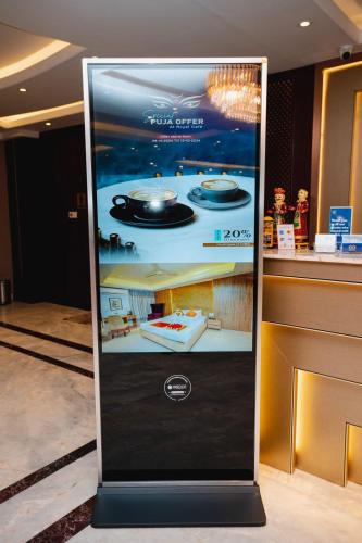 a sign for a food court in a store at Royal Raj Hotel in Rājshāhi