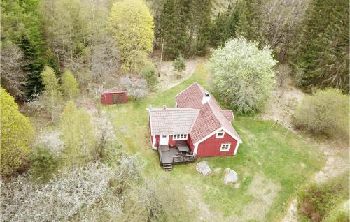 an aerial view of a red house in the grass at Pet Friendly Home In Ryd With Kitchen in Ryd