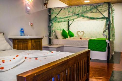 Ruveesha Ayurveda Resortにあるベッド