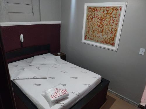 En eller flere senge i et værelse på Motel Sapucahy