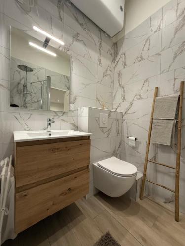 a bathroom with a toilet and a sink and a mirror at Studio Roma - Jean Médecin - LA RIVIERA LCD in Nice