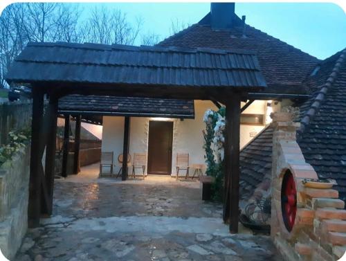 a patio with a wooden pergola at Konak Lecic in TrÅ¡iÄ‡