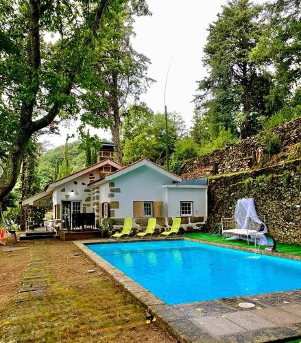 a house with a swimming pool in front of it at Quinta da Hortigueira - Country House in Trancoso