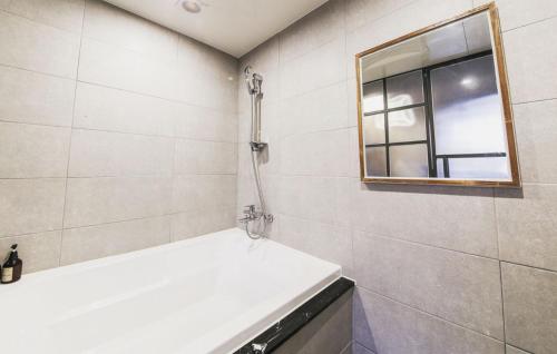 a bathroom with a shower and a window at Hotel Browndot Myeongseo Convention in Changwon