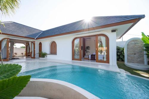 an image of a swimming pool in a house at The Adya Hidden Villa Ubud in Ubud
