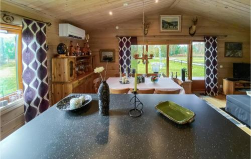 a kitchen and living room with a large counter top at 2 Bedroom Awesome Home In Rishult in Rishult