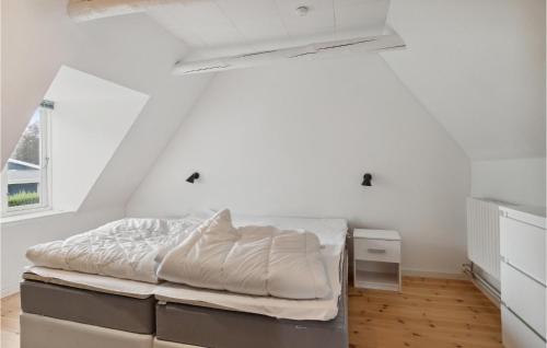 a white bedroom with a bed and a window at Amazing Home In Føllenslev With Wifi in Føllenslev