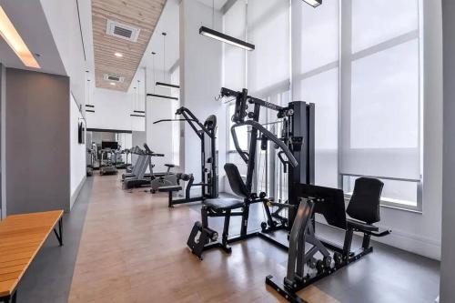 a row of tread machines in a gym at Dream House - Studio Premium, Piscina, Sauna e Garagem in Osasco