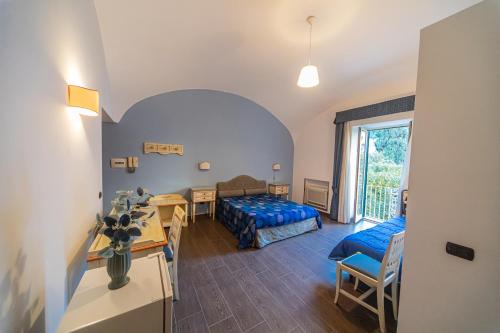 Postel nebo postele na pokoji v ubytování La Rada B&B
