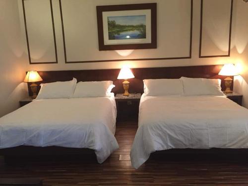 Кровать или кровати в номере D Savoy A Famosa by raisha