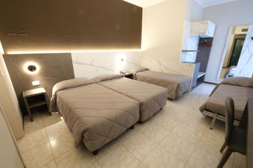 Кровать или кровати в номере Hotel Mistral