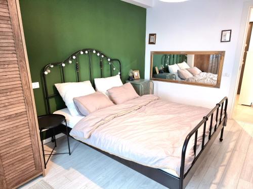a bedroom with a bed with a large mirror at Marianne, Apartament 2 Camere, Morii Lake 2 in Bucharest