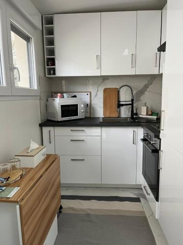 studio confort aux portes de paris, parking, jardin