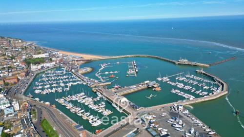 an aerial view of a marina with boats in the water at Aurora Spa Seaview Penthouse Ramsgate in Kent