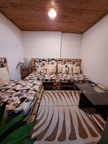 a bedroom with a large bed in a room at Hostal Prana in Abejorral