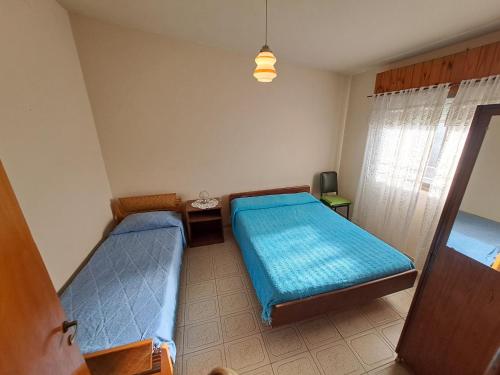 En eller flere senge i et værelse på Margarita