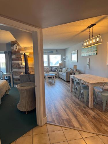 a living room and dining room with a dining table at Watson's Regency Suites in Ocean City
