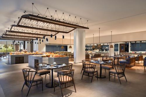 a restaurant with tables and chairs and a bar at The Westin Resort & Spa Cam Ranh in Cam Ranh