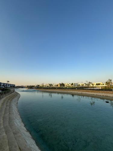 a body of water next to a beach at Small details2 Self-check-in in Riyadh