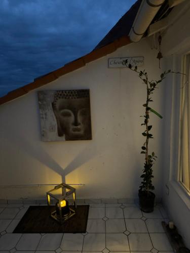 a room with a candle and a statue on a wall at La Terrasse de Callian in Callian