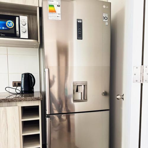 a stainless steel refrigerator in a kitchen at Departamento Av Los Pescadores in Coquimbo