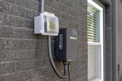 a pay phone on the side of a brick wall at The Luxe Hot Tub10 Min Keenland12 Min Downtown in Lexington