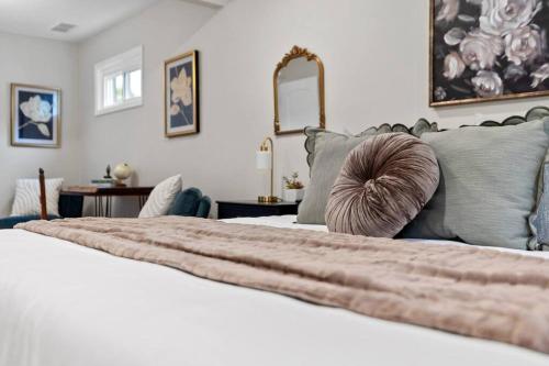 a bedroom with a bed with a pillow on it at The Luxe Hot Tub10 Min Keenland12 Min Downtown in Lexington