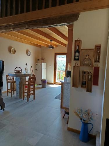 a kitchen and dining room with a table and chairs at Casa tapada da branda in Monção
