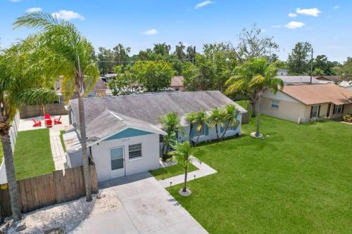 an aerial view of a house with a yard at Serenity by the Sea Heated Pool and Spa in Apollo Beach