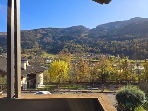 a view from the balcony of a house with a mountain at Fior di Larice - Alpine Stay Apartments in Ziano di Fiemme