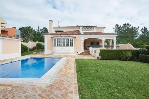 Noble beach villa with private garden and pool