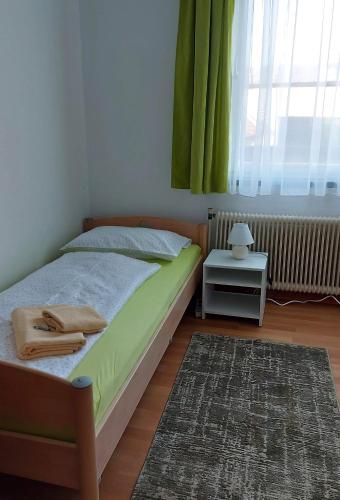 Postel nebo postele na pokoji v ubytování Gästehaus Franz