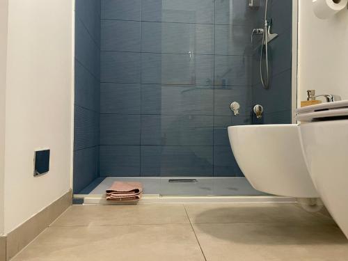 a bathroom with a shower with a tub and a sink at Green Stay Bergamo in Bergamo
