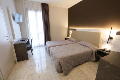 Кровать или кровати в номере Hotel Mistral