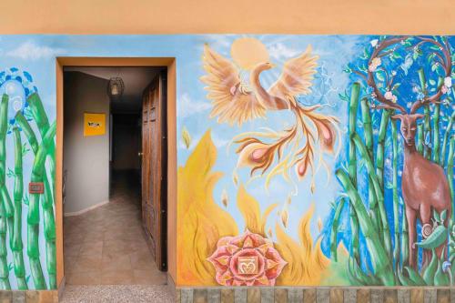 a hallway with a painting on the wall at La Casa Zen in San Giovanni Teatino