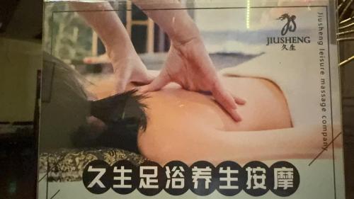 a poster of a woman with her hands on her head at Gucheng Lanshe Designer Garden B&B in Lijiang