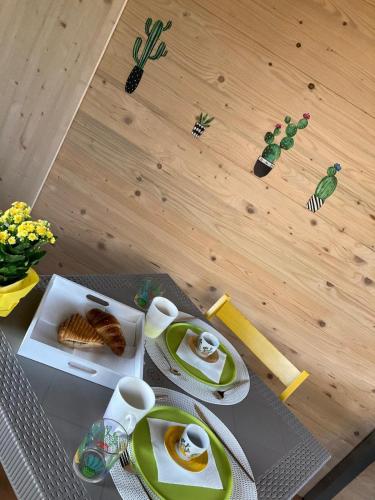 a table with a plate of food on top of it at Poggio del Poeta in Osmate Lentate