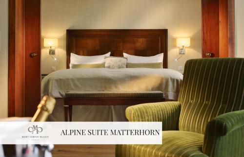 a hotel room with a bed and two chairs at Mont Cervin Palace in Zermatt